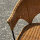 Wicker and black wrought iron armchair