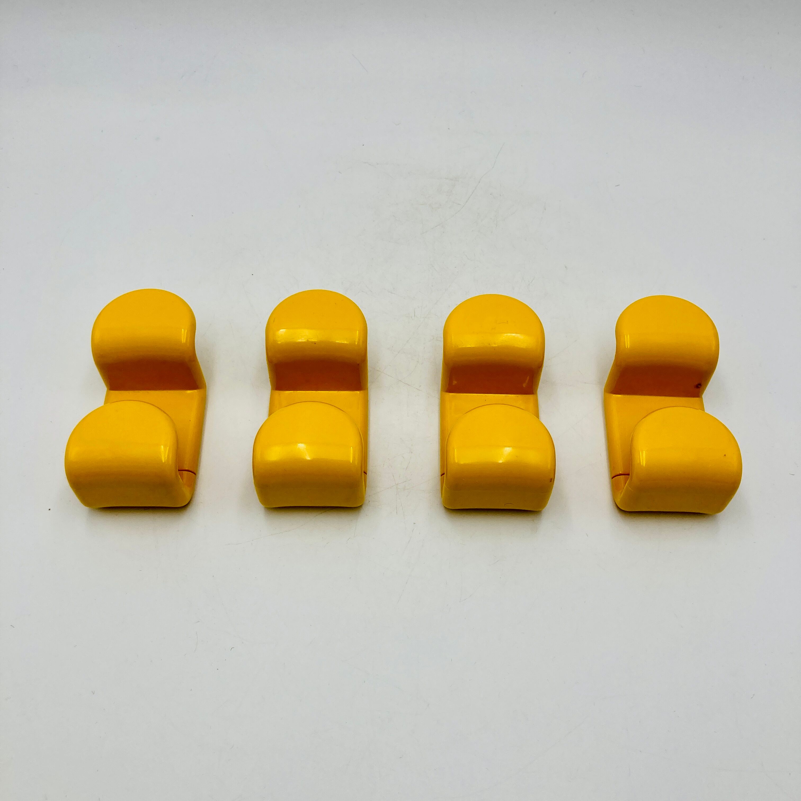 Yellow plastic hooks, design A. Rossari, Gedy edition.