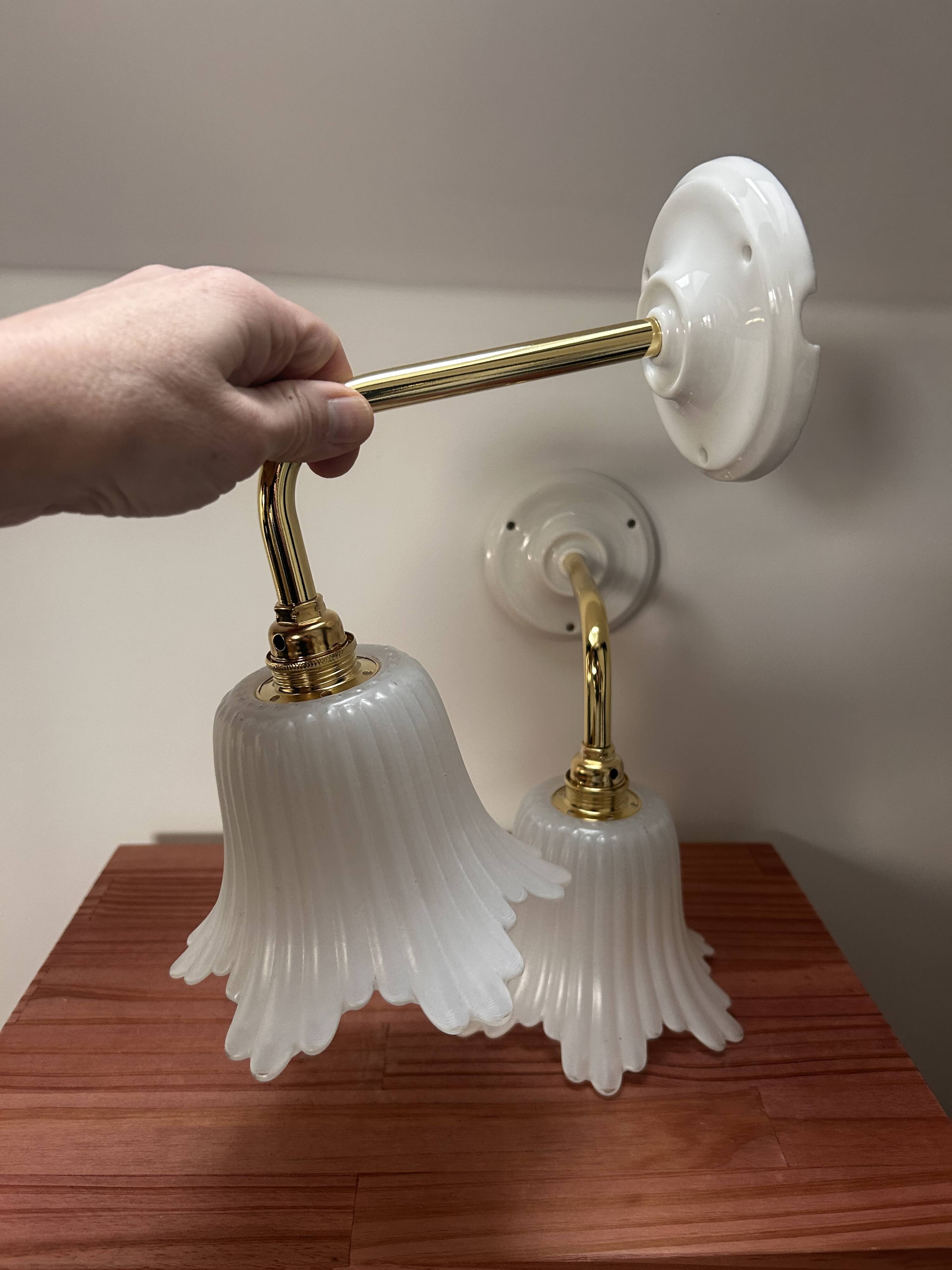 Pair of white tulip wall sconces
