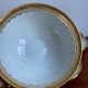 6 cups and golden porcelain saucers