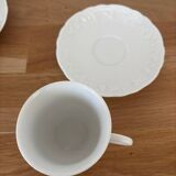 5 cups, 4 saucers and a creamer in Philippe Deshoulières porcelain