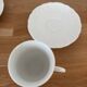 5 tasses 4 soucoupes et un crémier en porcelaine Philippe Deshoulières