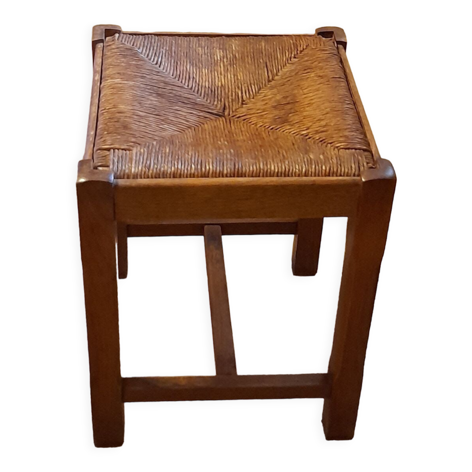 Oak stool seated in straw