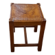 Oak stool seated in straw