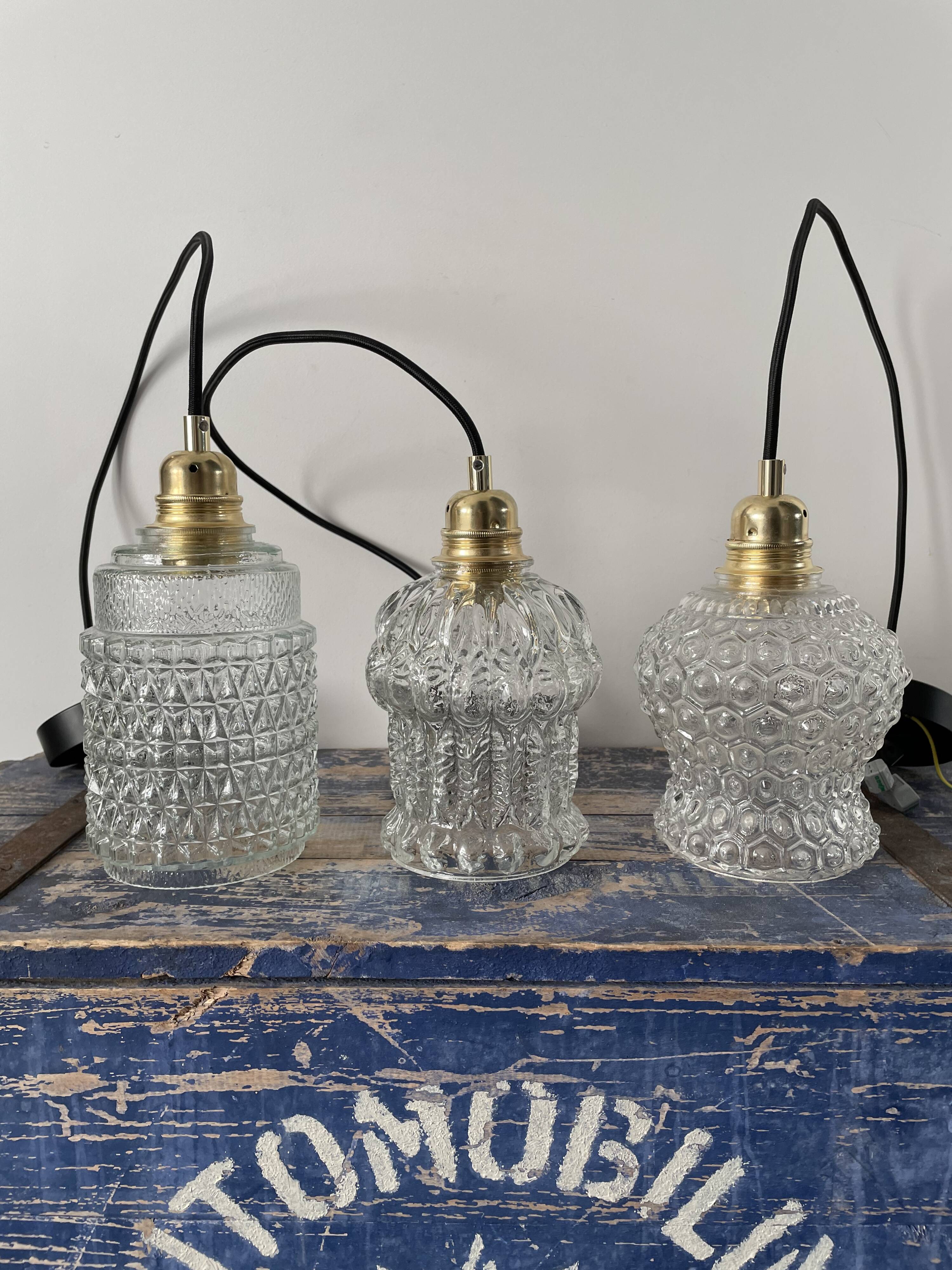 Set of three vintage electrified glass pendant lamps