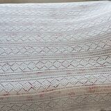 White two-seater crocheted bed top