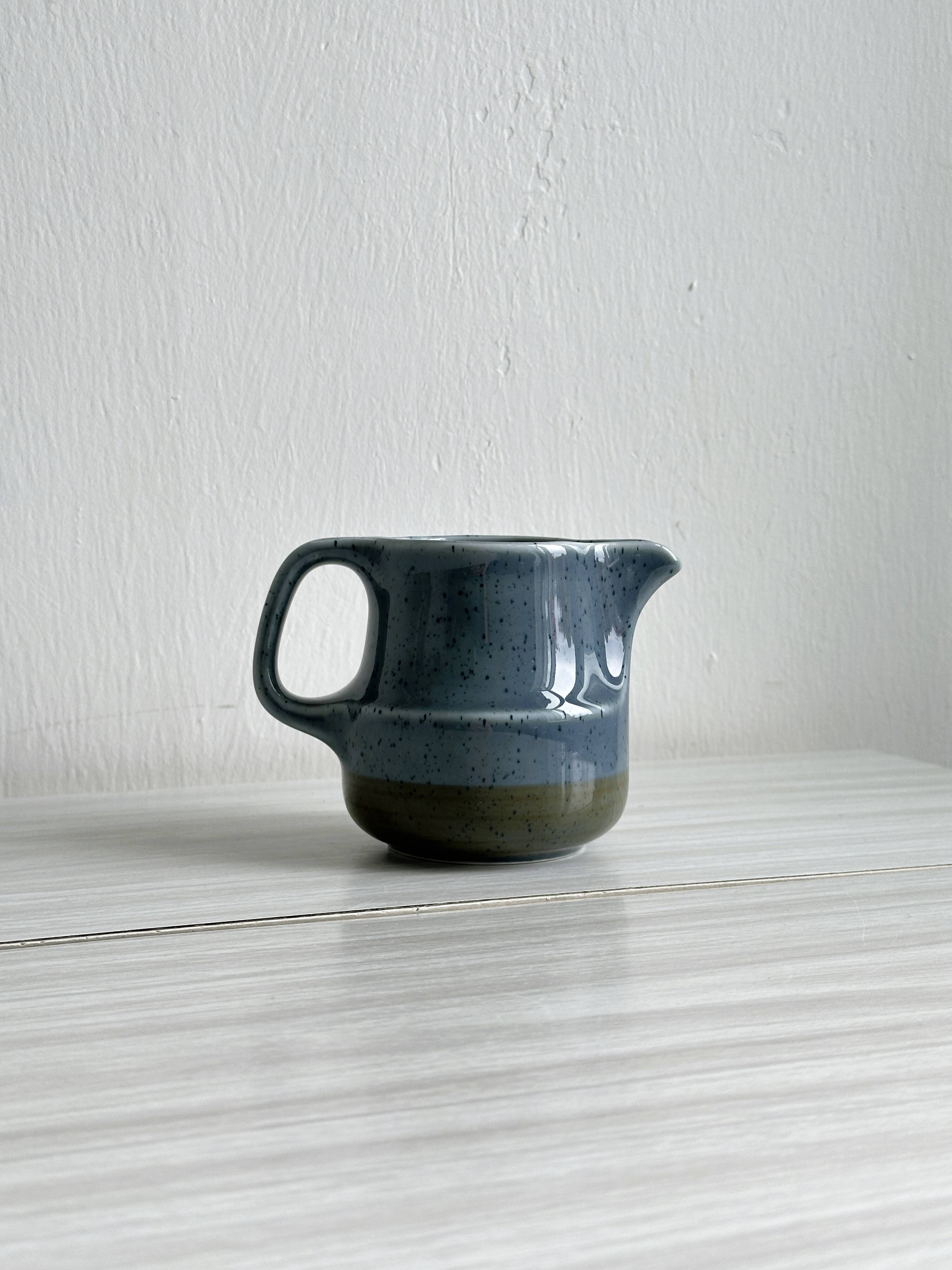 Blue and beige ceramic milk jug