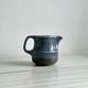 Blue and beige ceramic milk jug