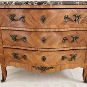 Curved Louis XV style commode in marquetry, veined marble and ornamentation.