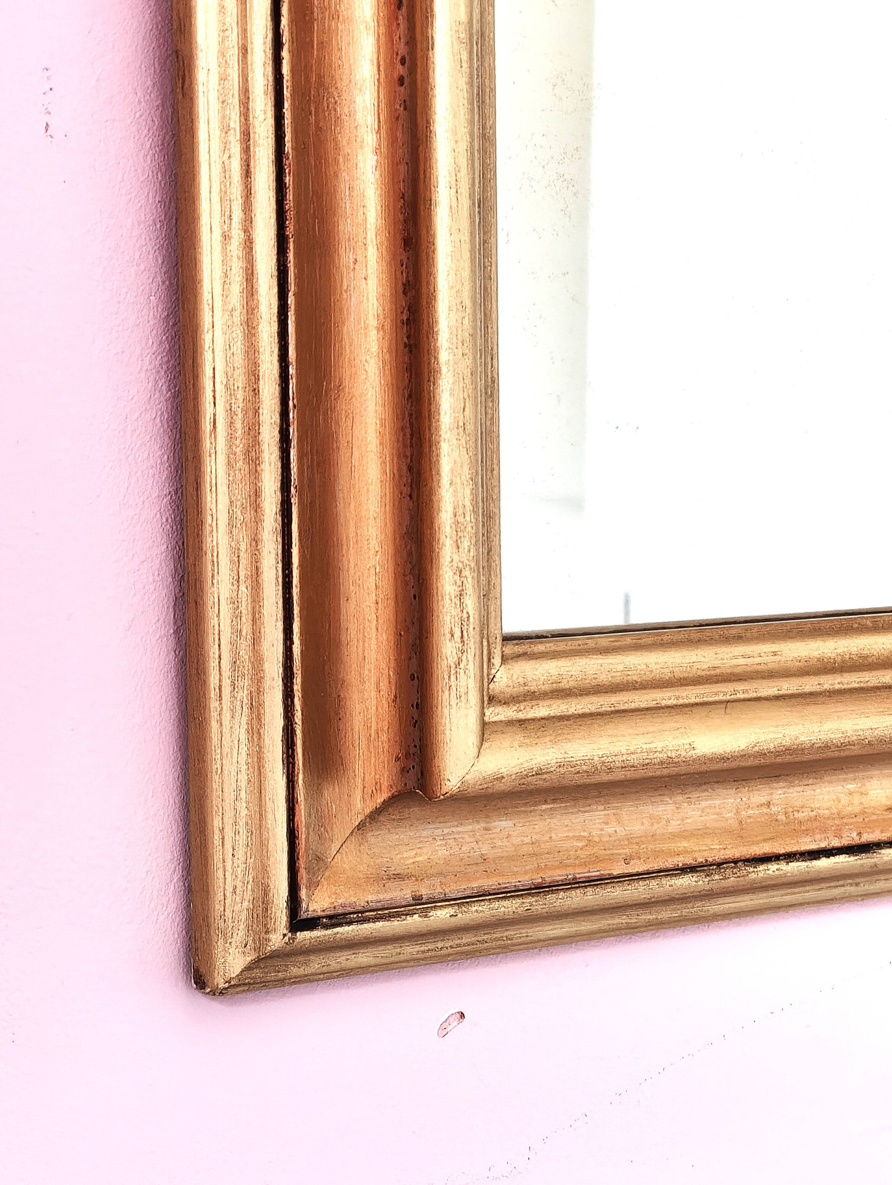 Miroir ancien en bois doré et cuivré