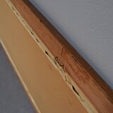 wall mirror in a decorative wooden frame.