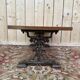 Table basse pieds fonte et plateau bois parquet