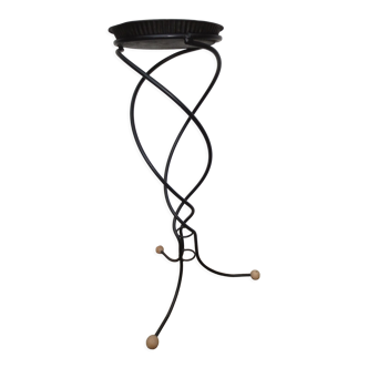 Plant or flower holder in black wrought iron of helical shape