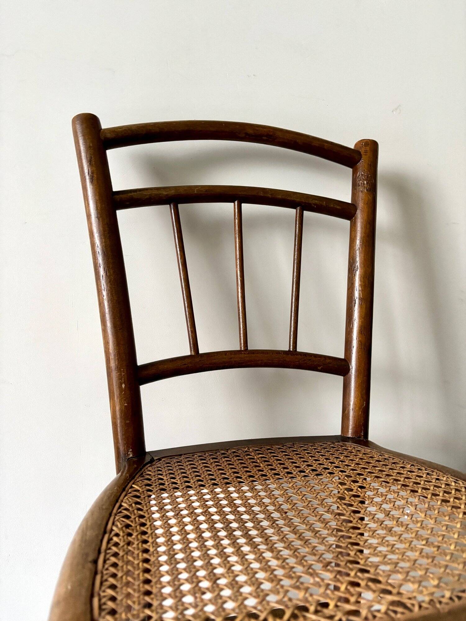 Wooden and cane bistro chair