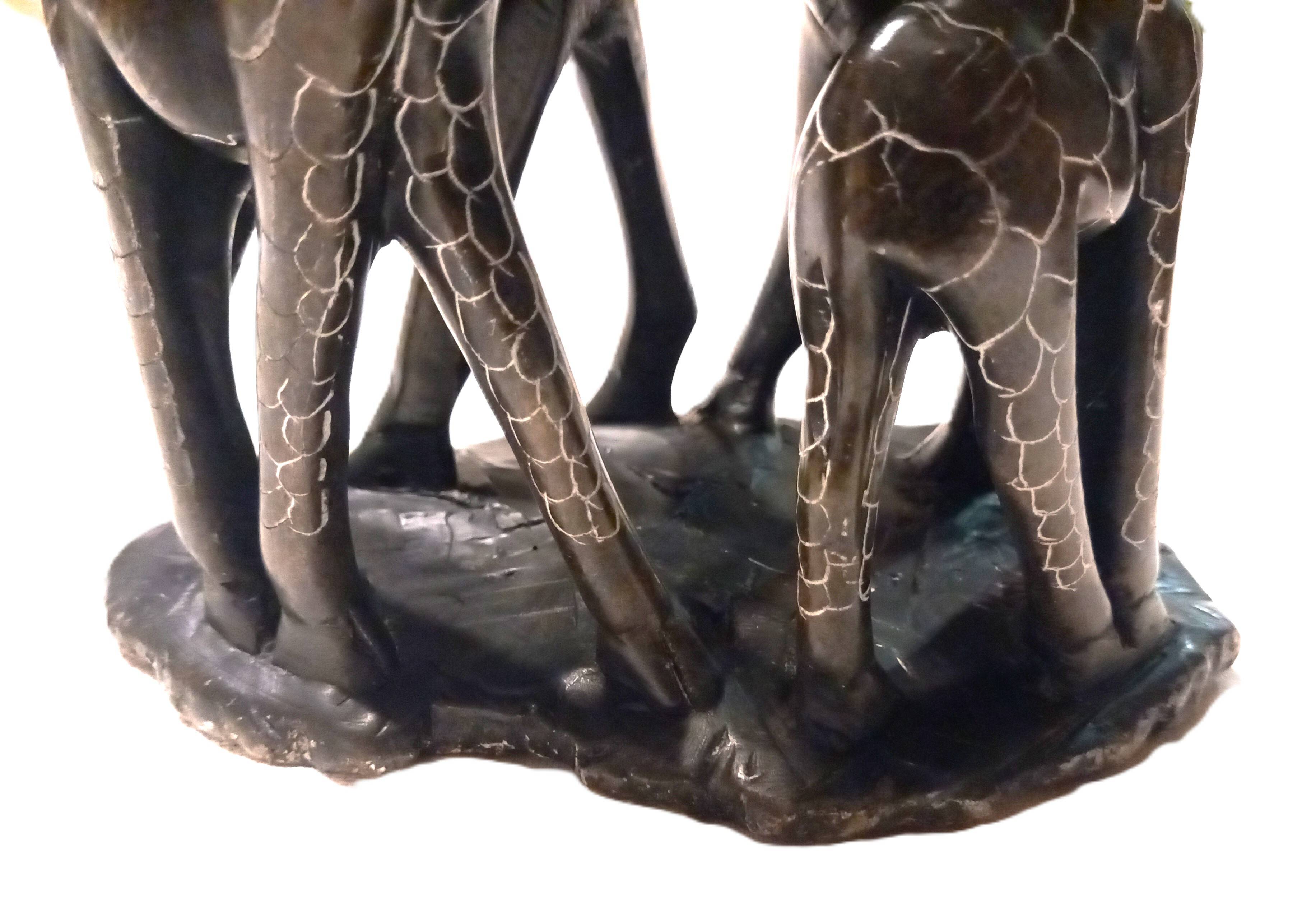 African stone sculpture of 3 Giraffes