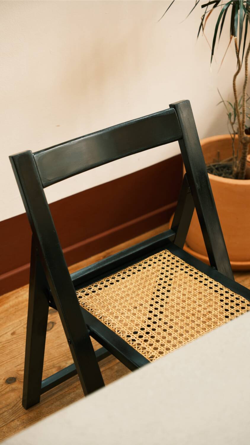 4 black cane folding chairs