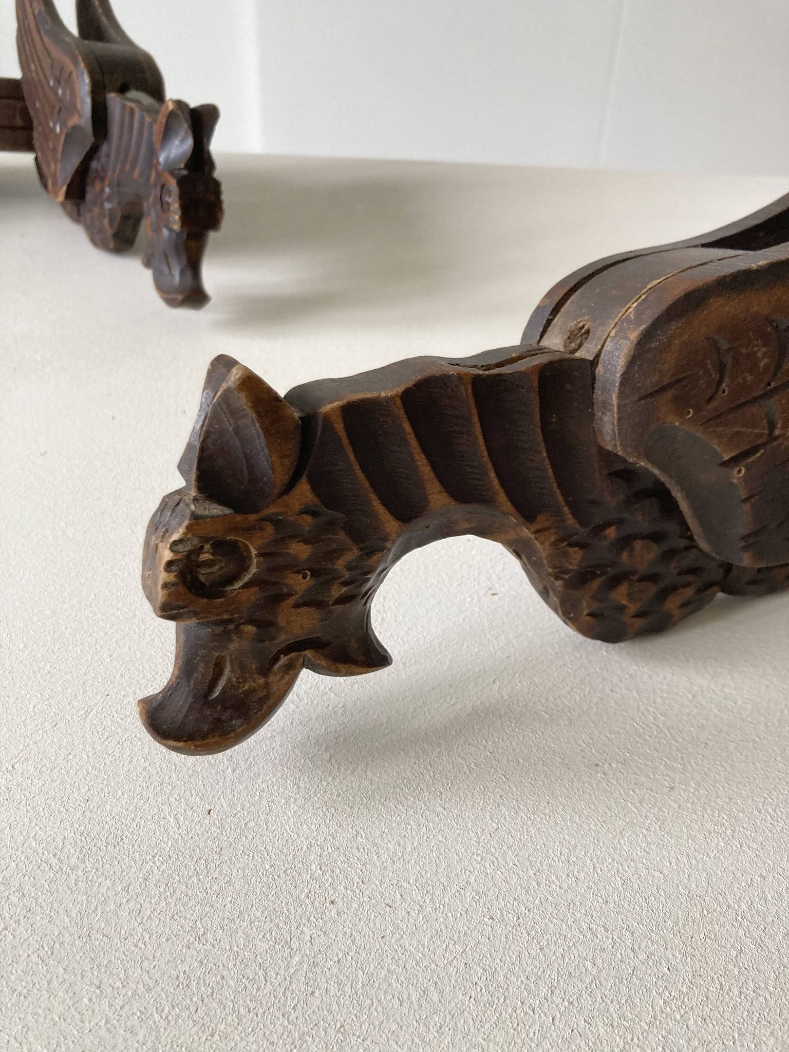 Pair of winged dragon sconces in carved wood