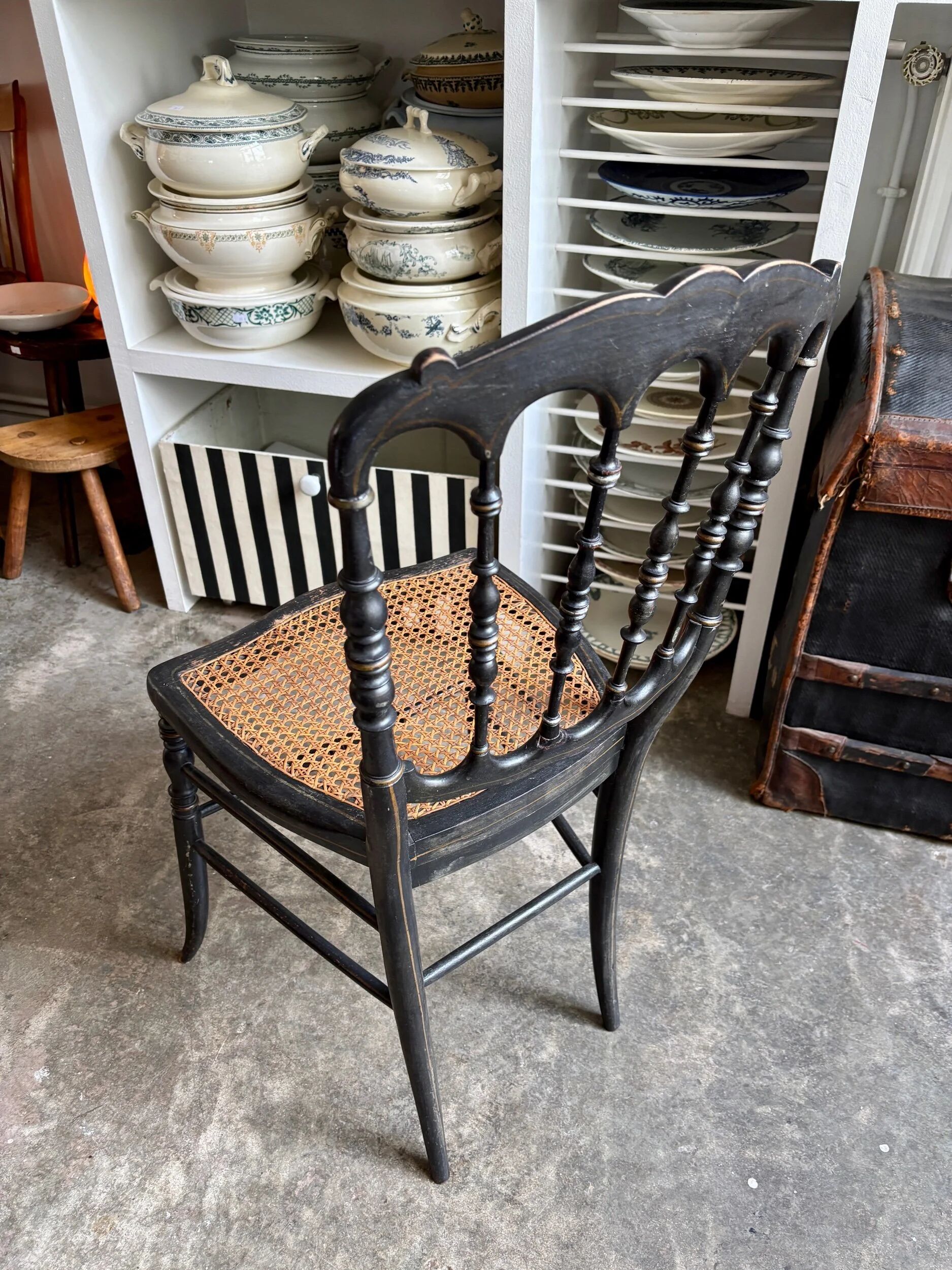 Napoleon III chair in black and gold wood with caning.