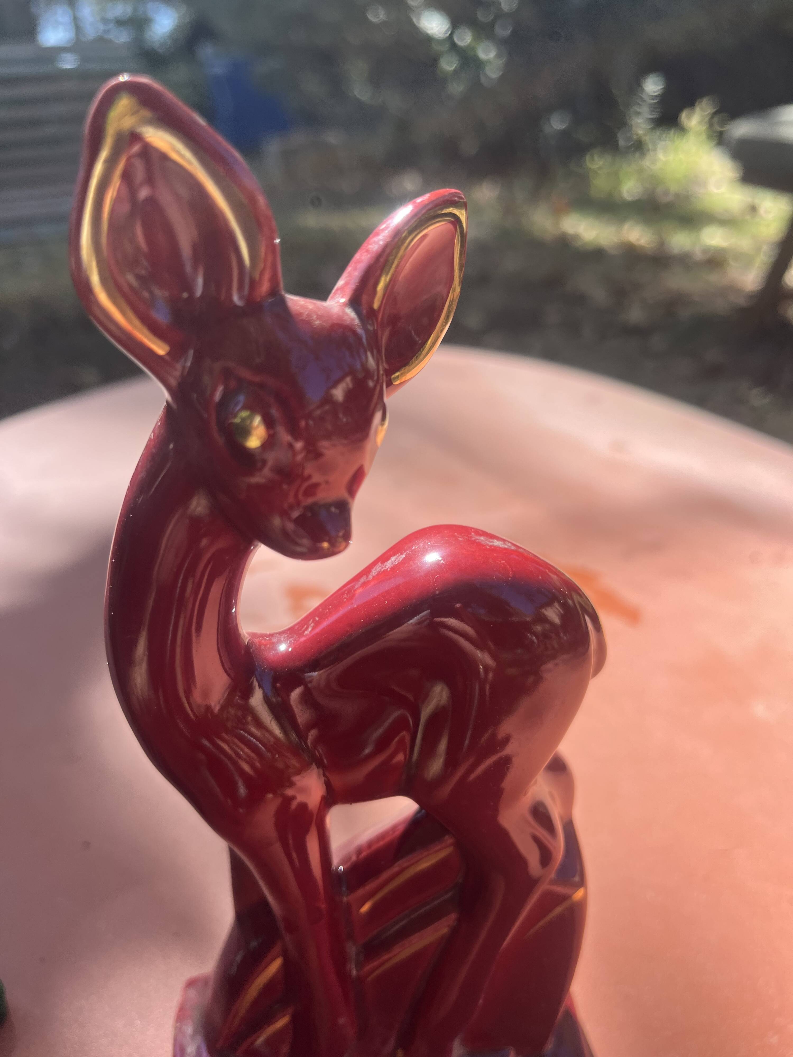 Pair of Art Deco deer by Charles Lemanceau in red and green ceramic.