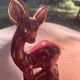 Pair of Art Deco deer by Charles Lemanceau in red and green ceramic.