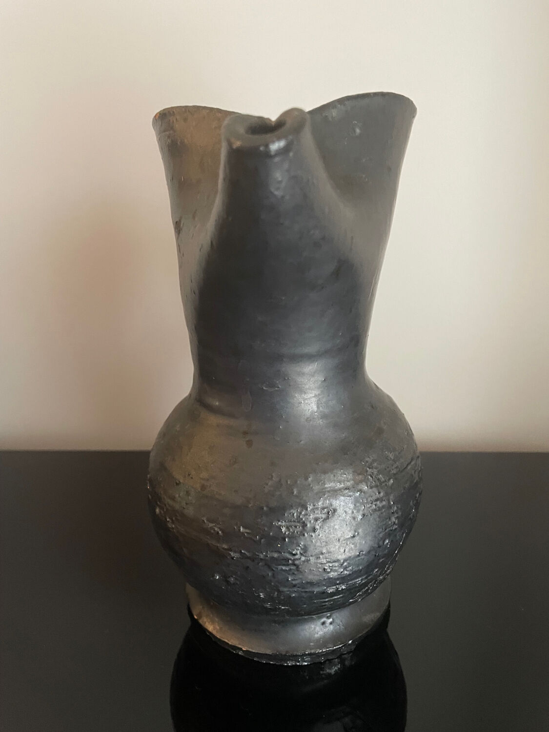 Black ceramic pitcher by Jean Marais