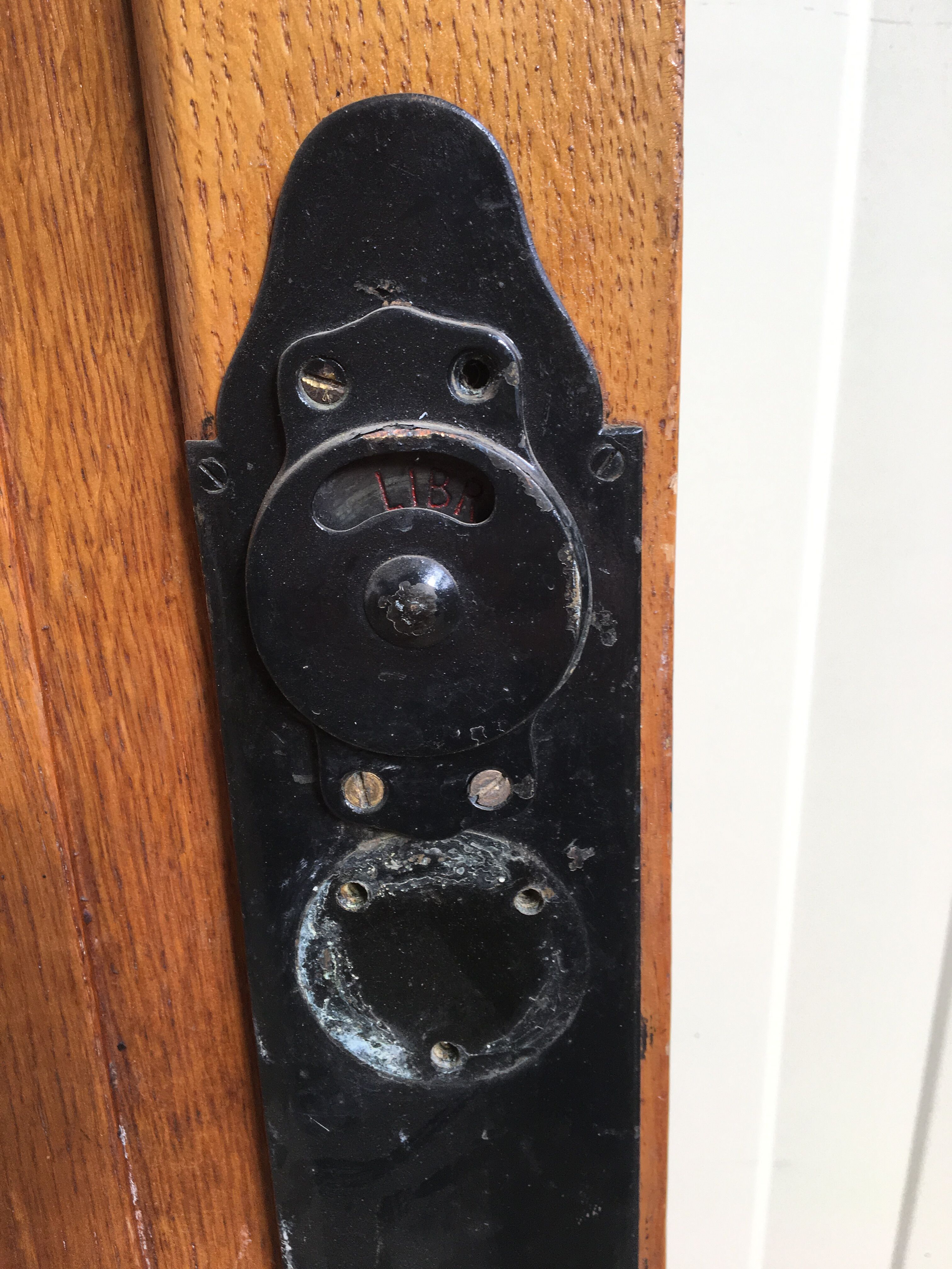 old sanitary door of the bank of France in oak