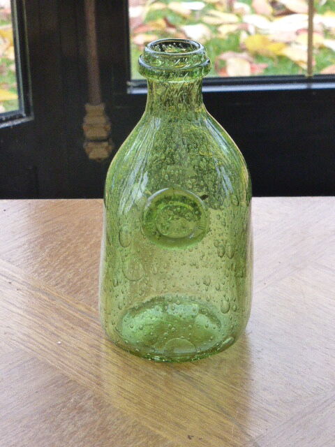 Biot stamped blown glass bottle