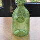 Biot stamped blown glass bottle