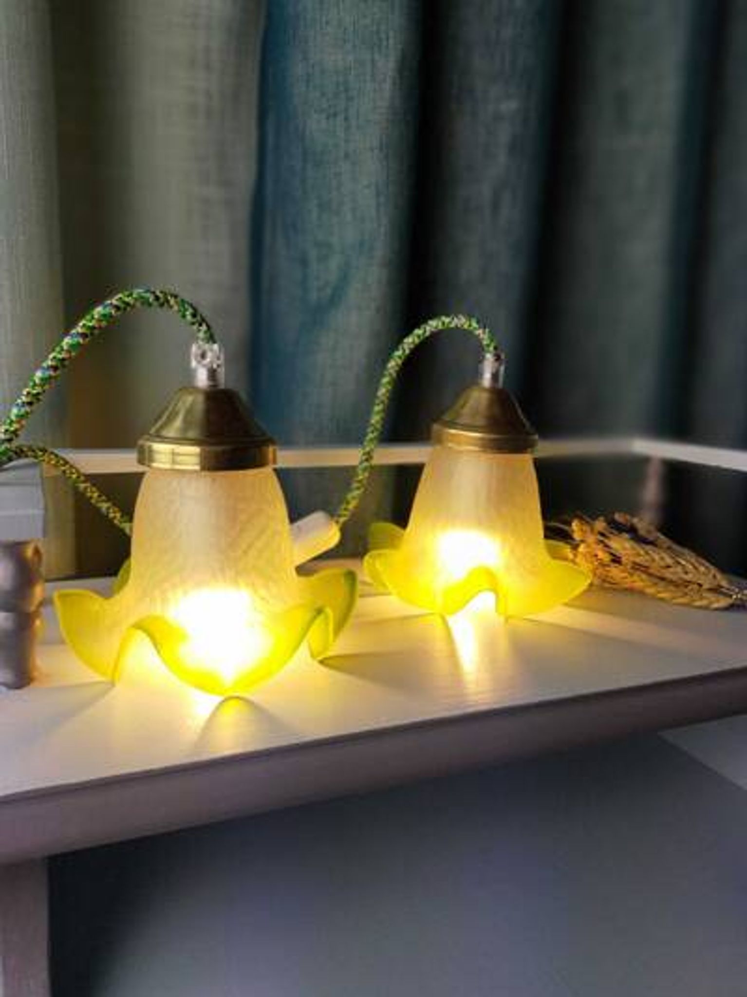 Duo of portable lamps in green tulip design.