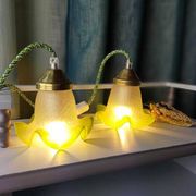 Duo of portable lamps in green tulip design.