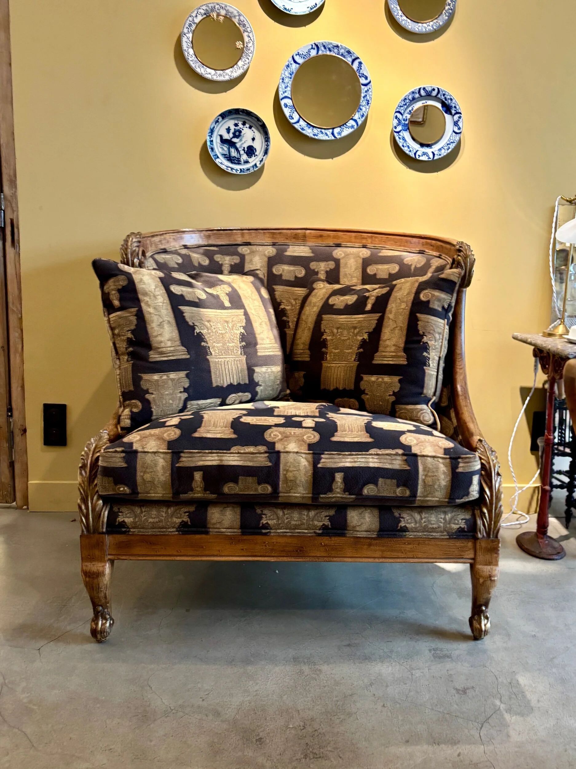 Armchair in a wooden confessional style with black and beige cotton.