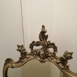 Miroir mural avec ornements dores patine