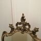 Wall mirror with gold patina ornaments