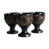 3 black ceramic egg cups with floral patterns