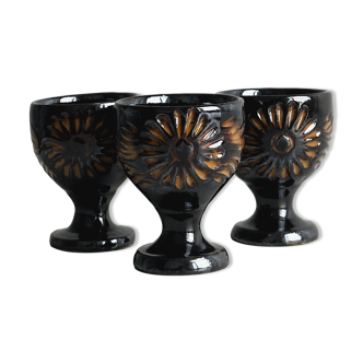3 black ceramic egg cups with floral patterns