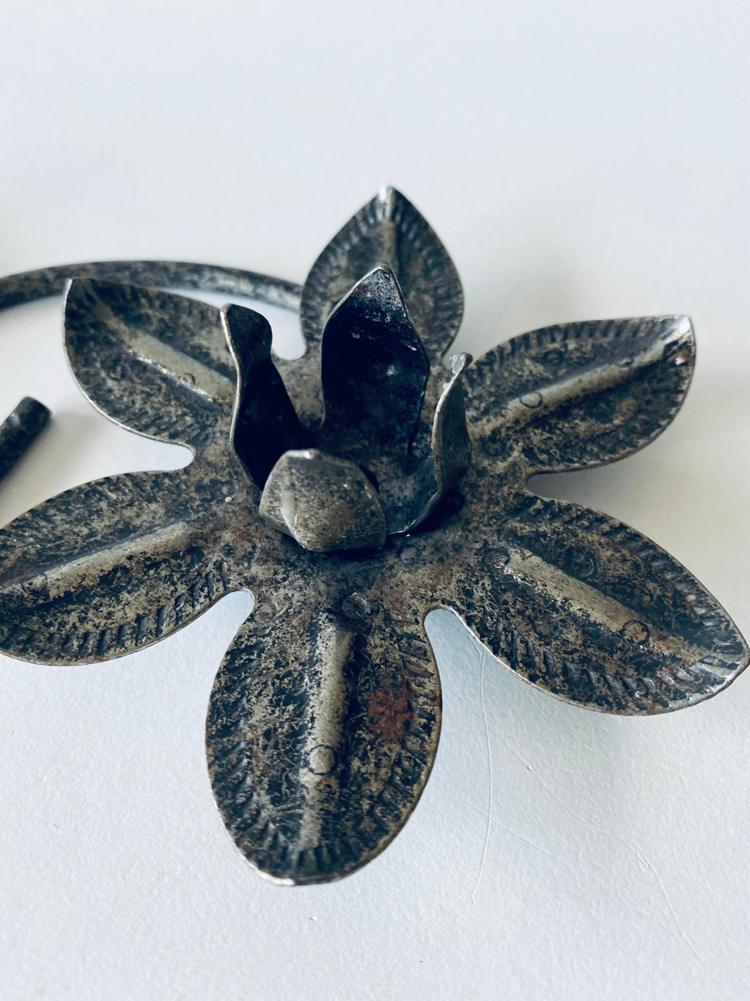 Pair of iron water lily candle holders