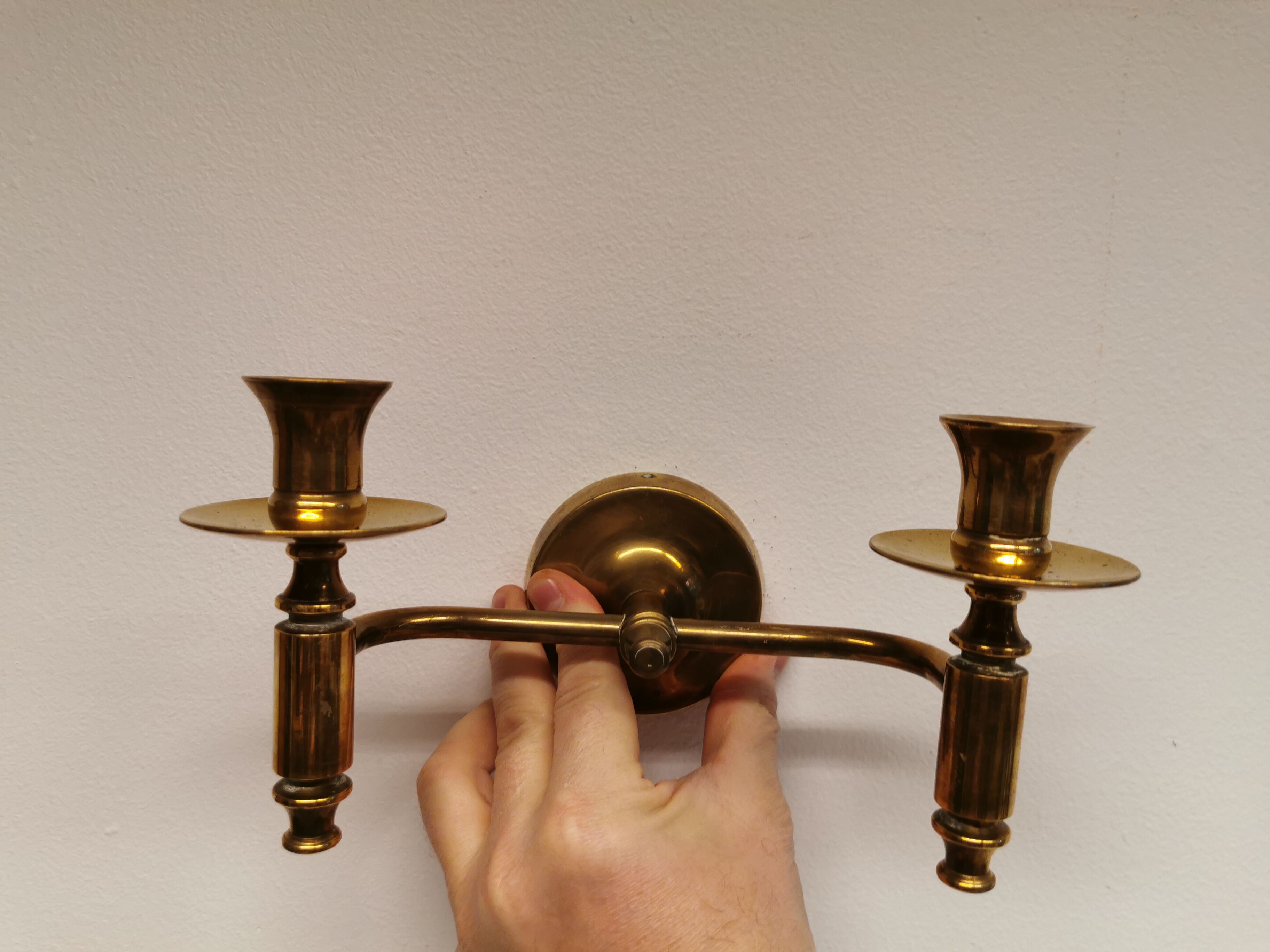 Classic Danish wall hung design candlestick in solid brass