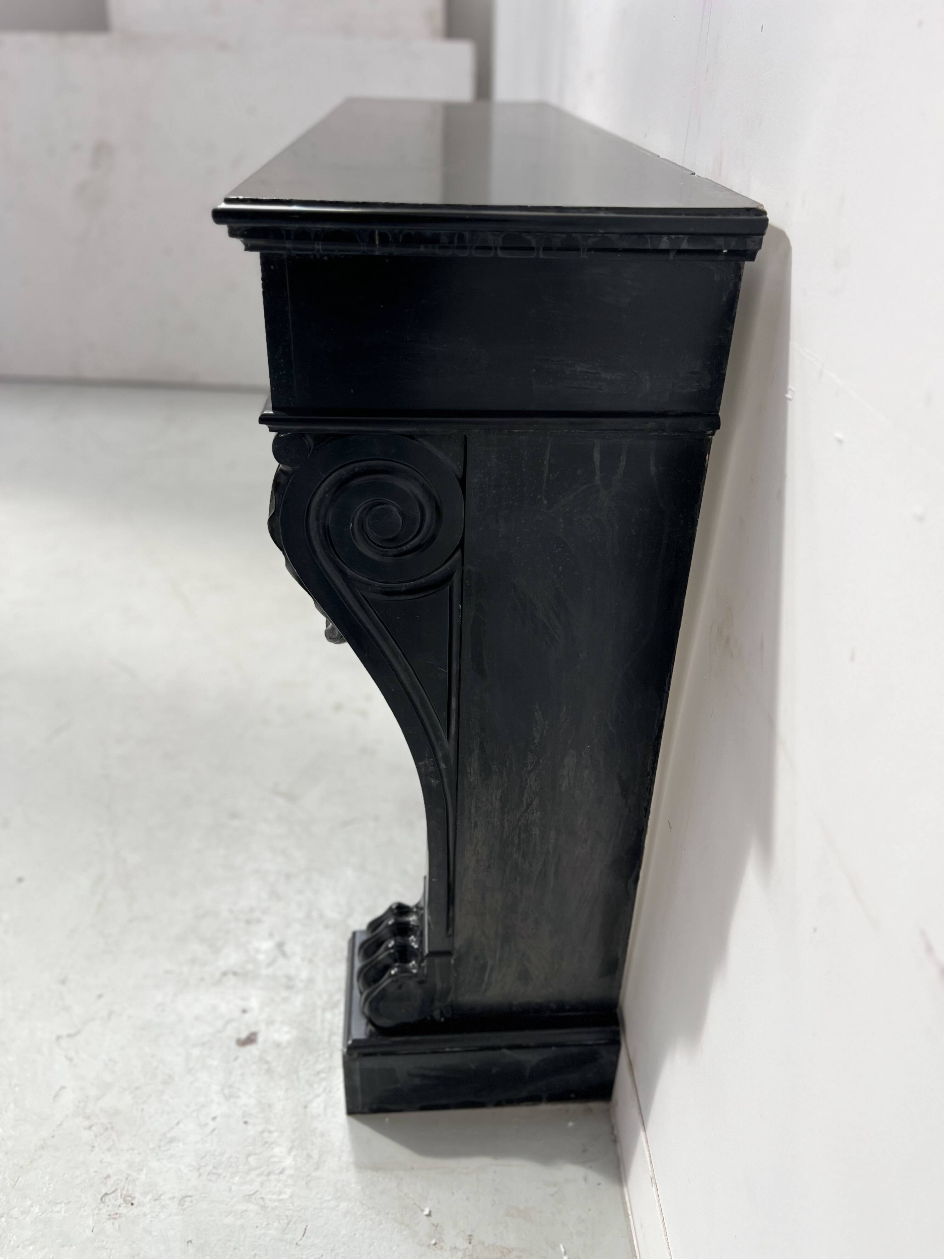 Napoleon III fireplace with claw feet in black marble, 19th century