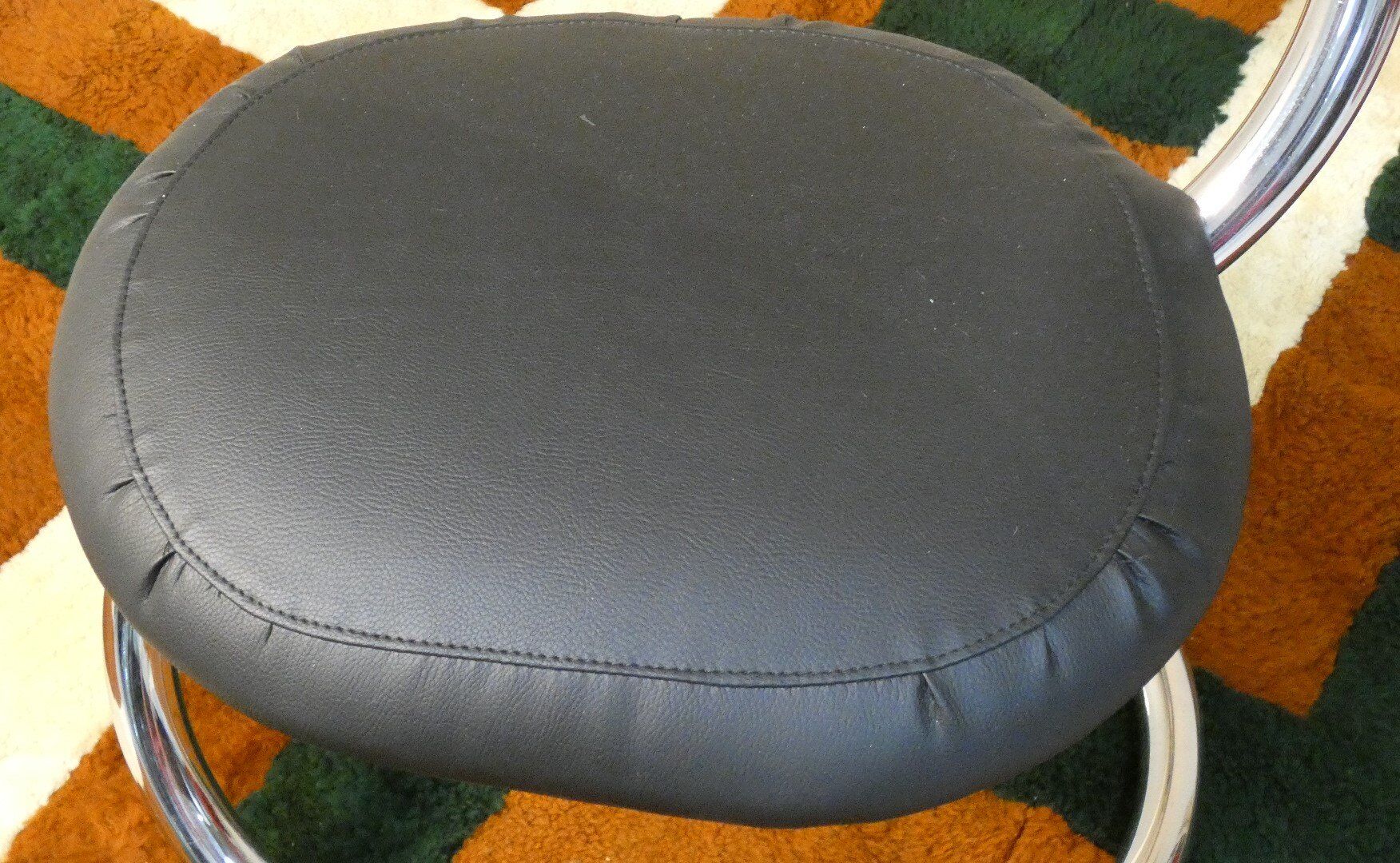 Cobra chairs in steel and black leather by Giotto Stoppino, 1970s, set of 5.