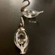 2 swan-shaped salt pots in metal and glass