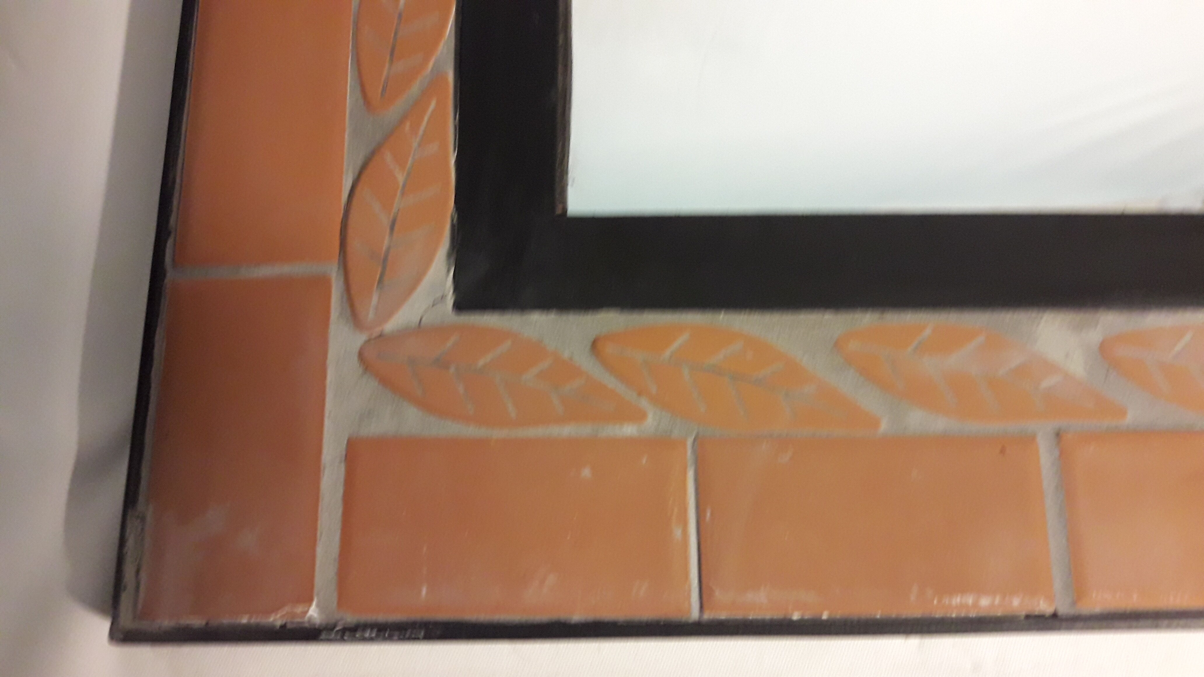 Mirror with terracotta frame