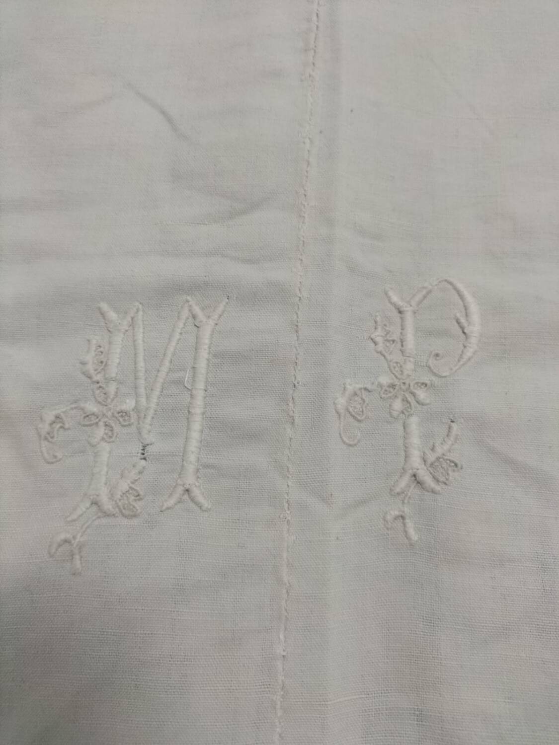 Old fabric, embroidered with the monogram MP.