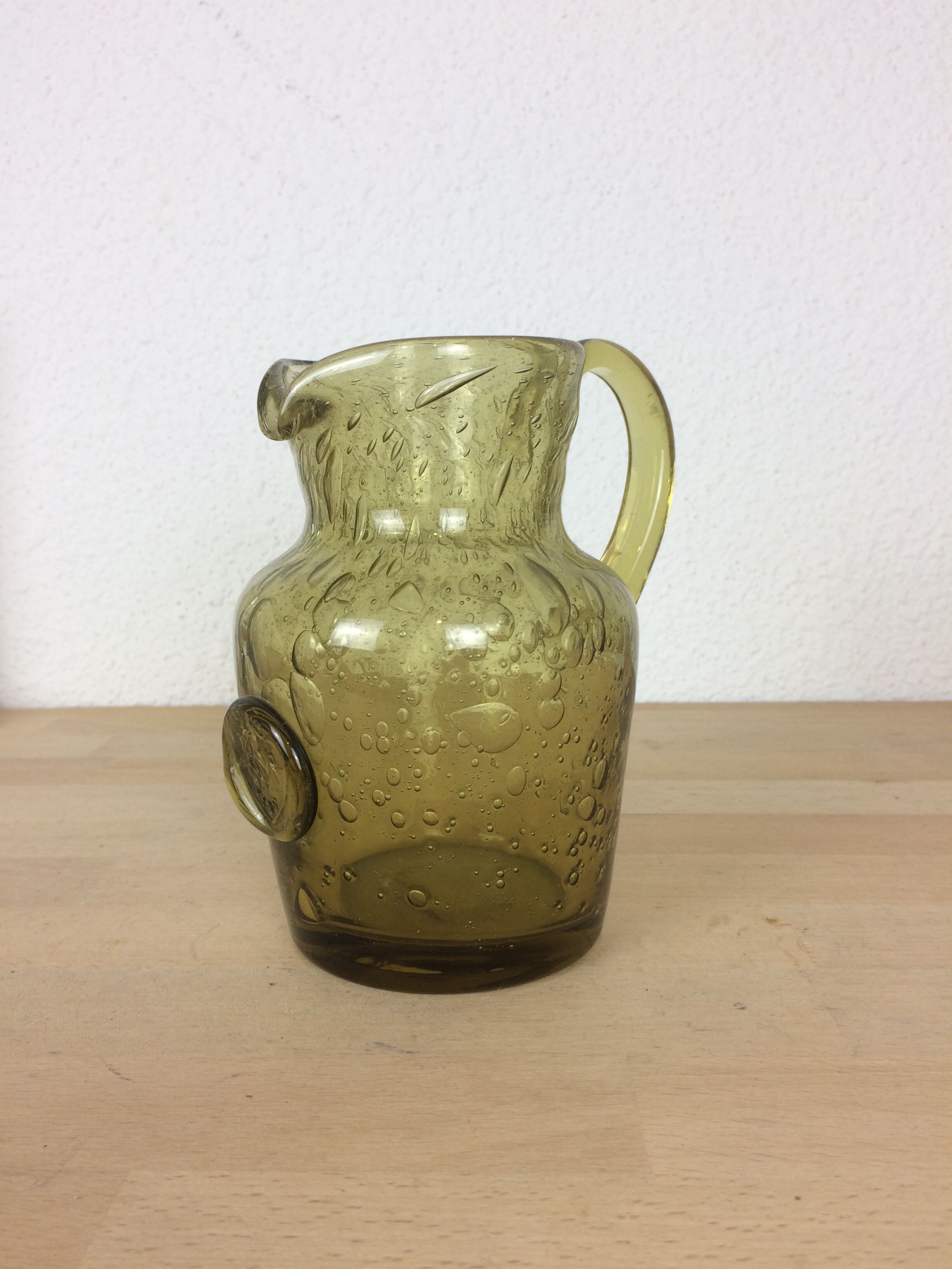 Green bubbled glass pitcher