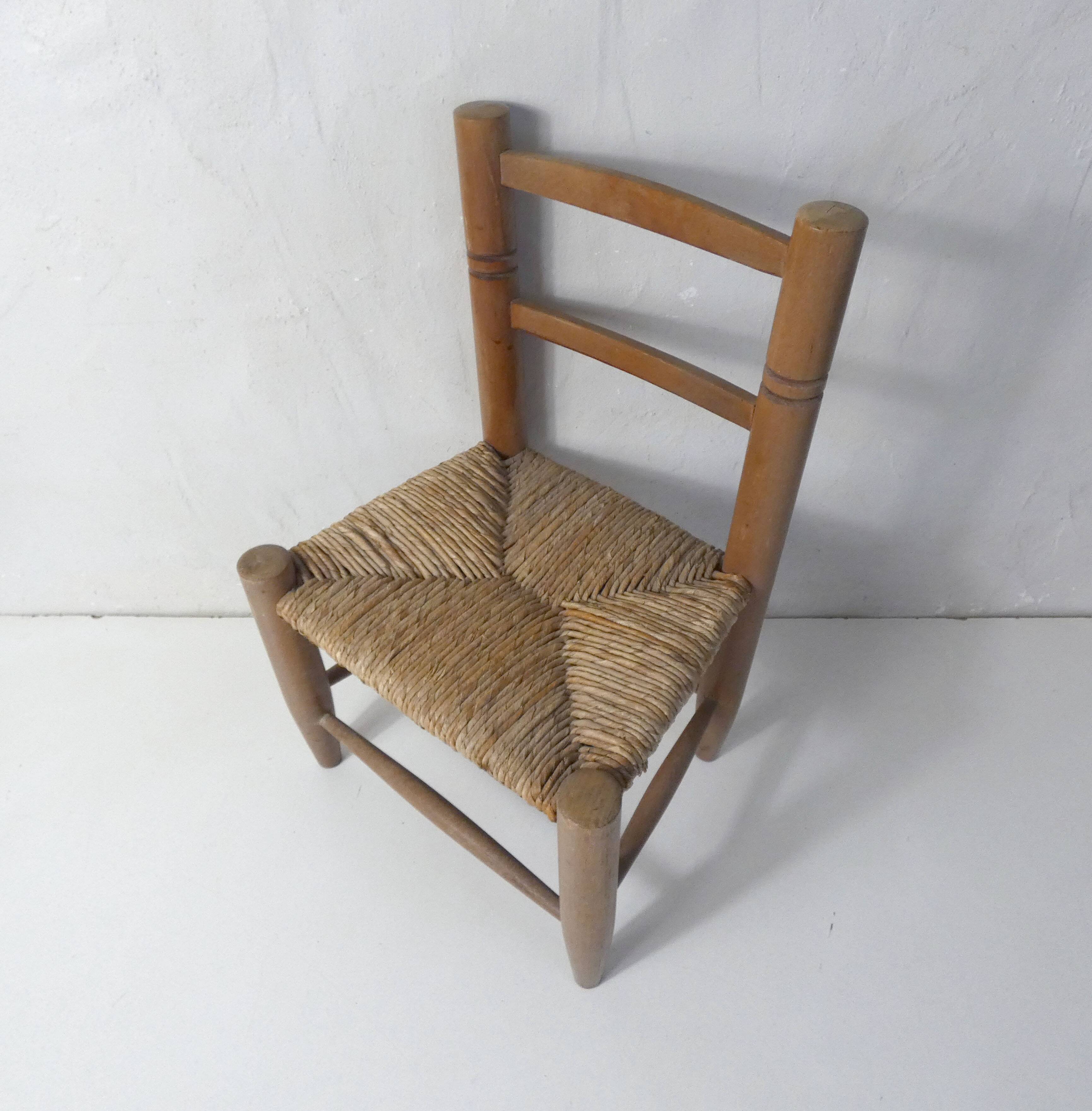Old wooden straw chair for children