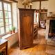 Vintage Louis Philippe style bonnetière wardrobe from the 1800s in cherry wood.
