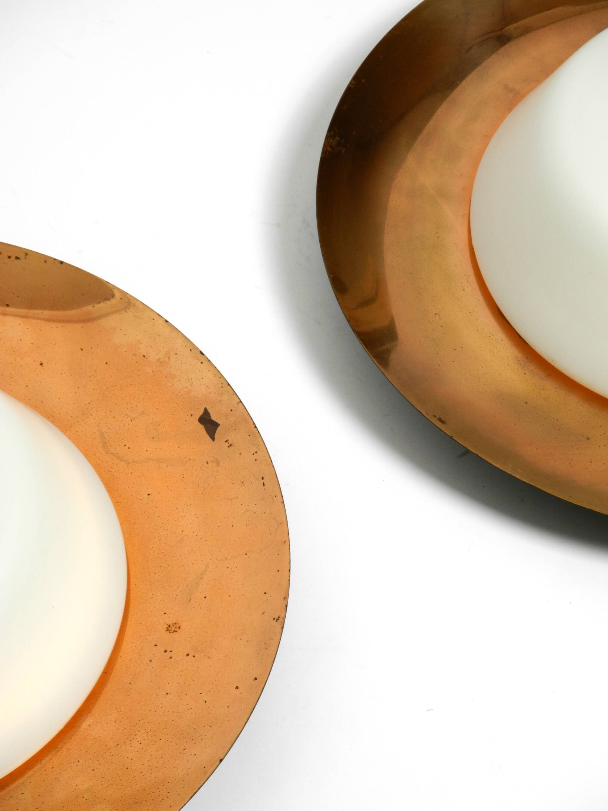 Pair of Mid Century wall or ceiling lamps made of glass with copper-plated