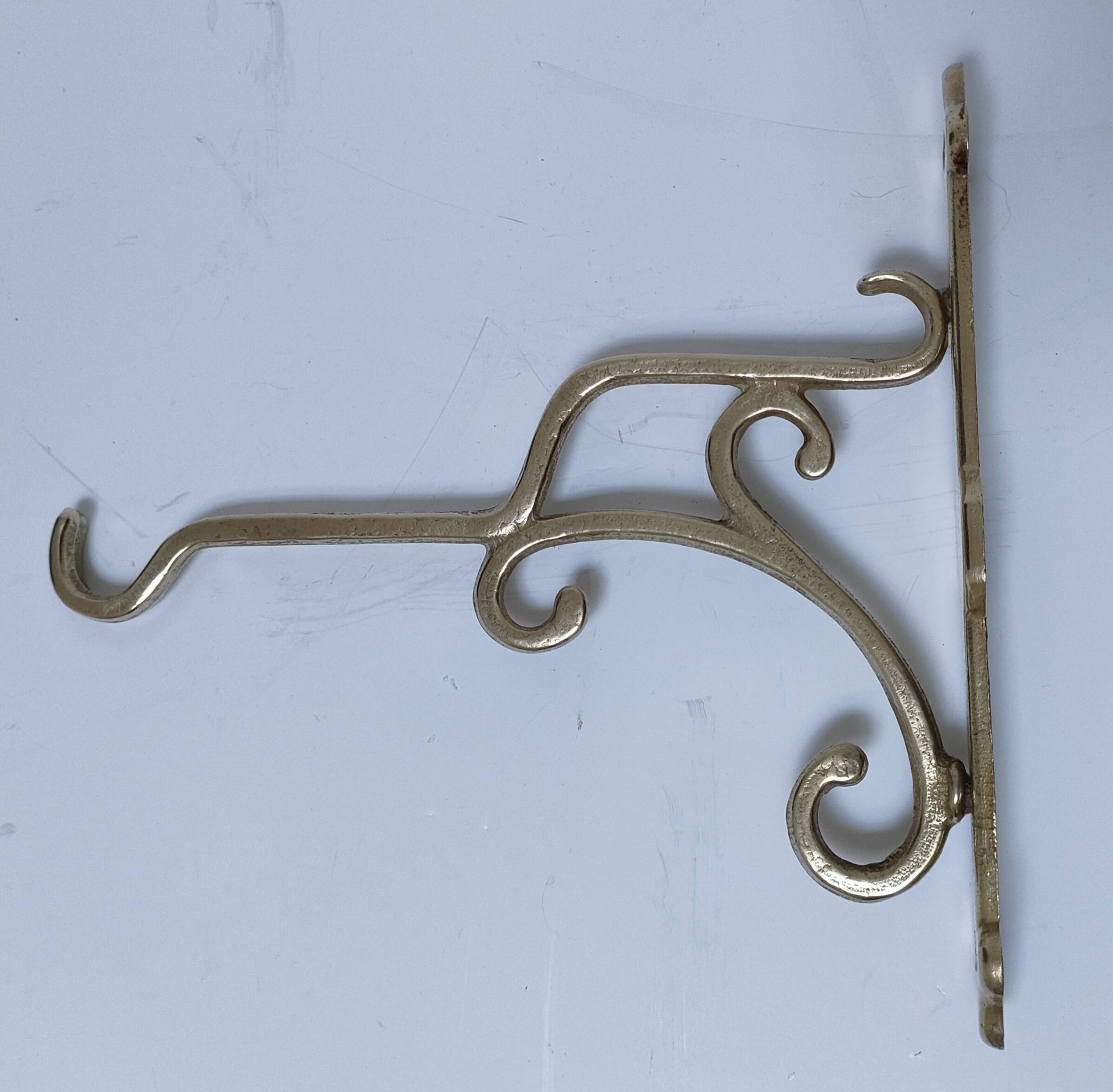 Three brass, chrome, aluminum hooks, early 20th century