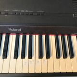 Roland HP 700 keyboard and its stand with pedal