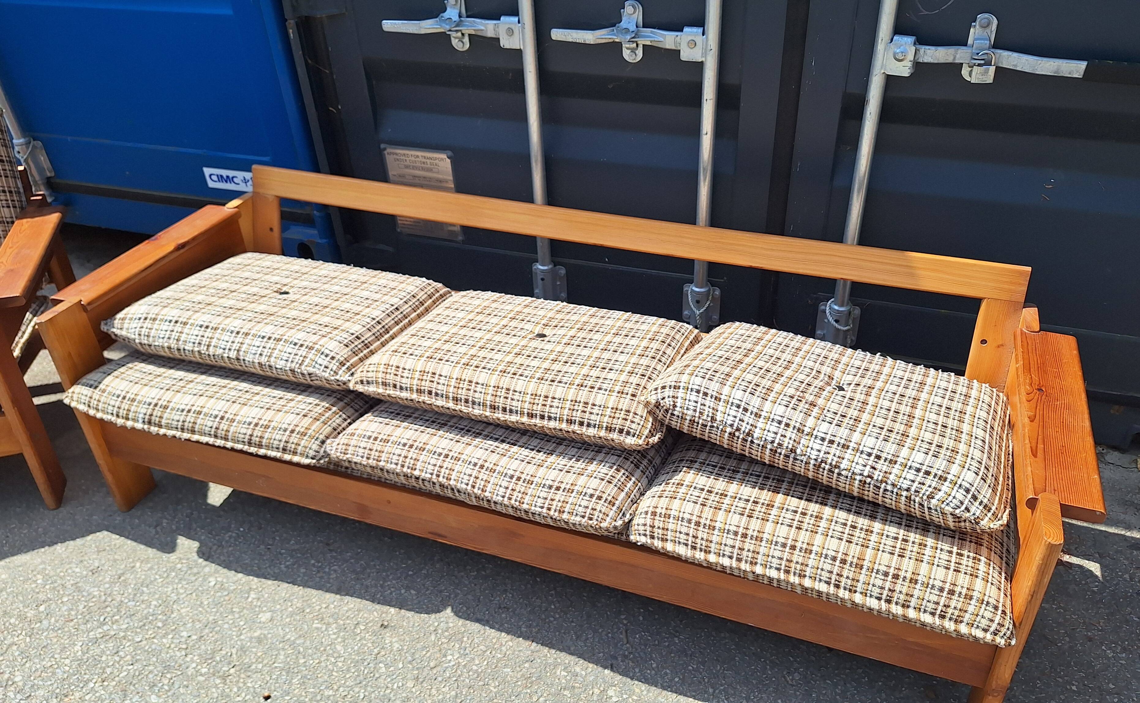 Brutalist-style bench and armchairs in 1970s pine.