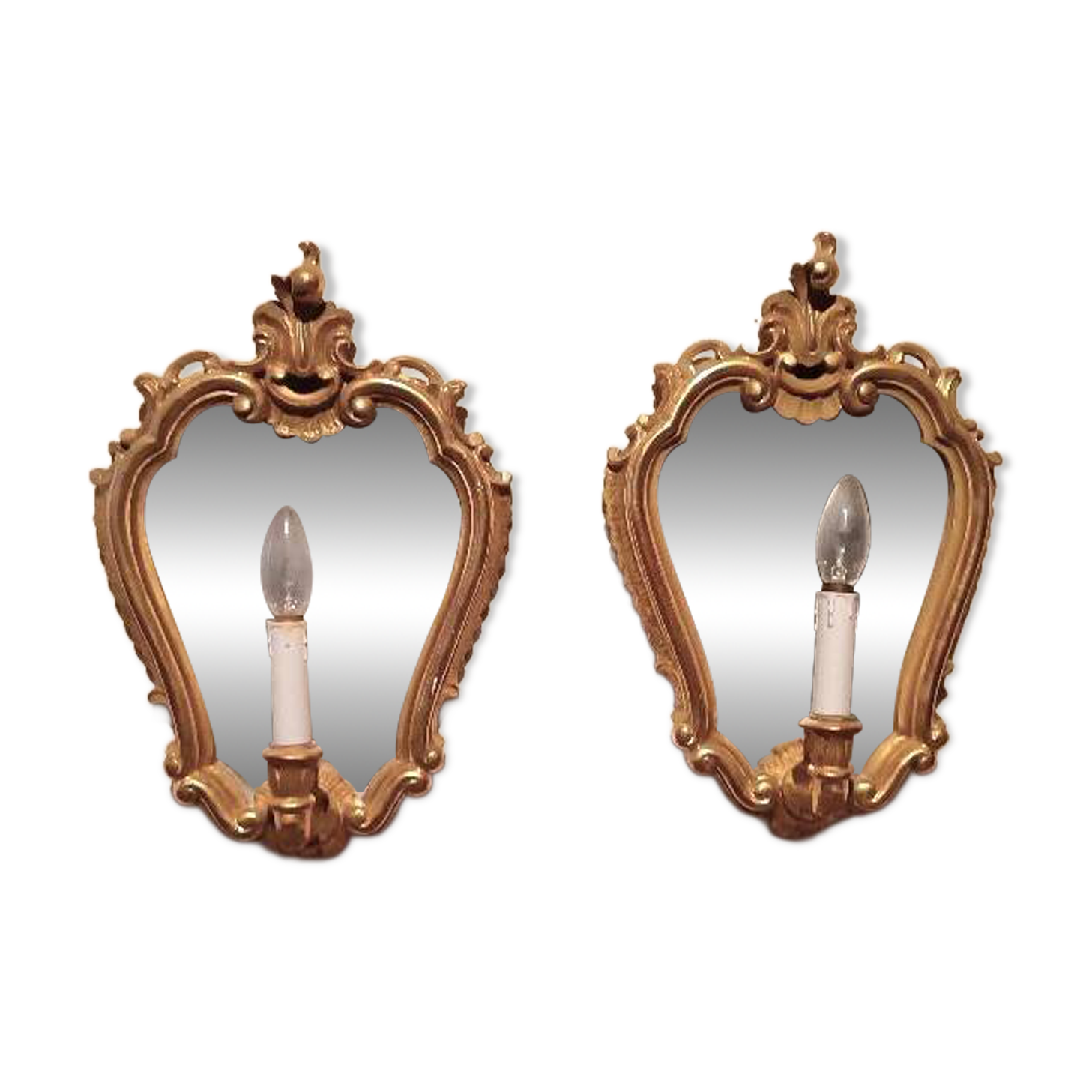 Vintage gold mirror sconces from the late 1950s.